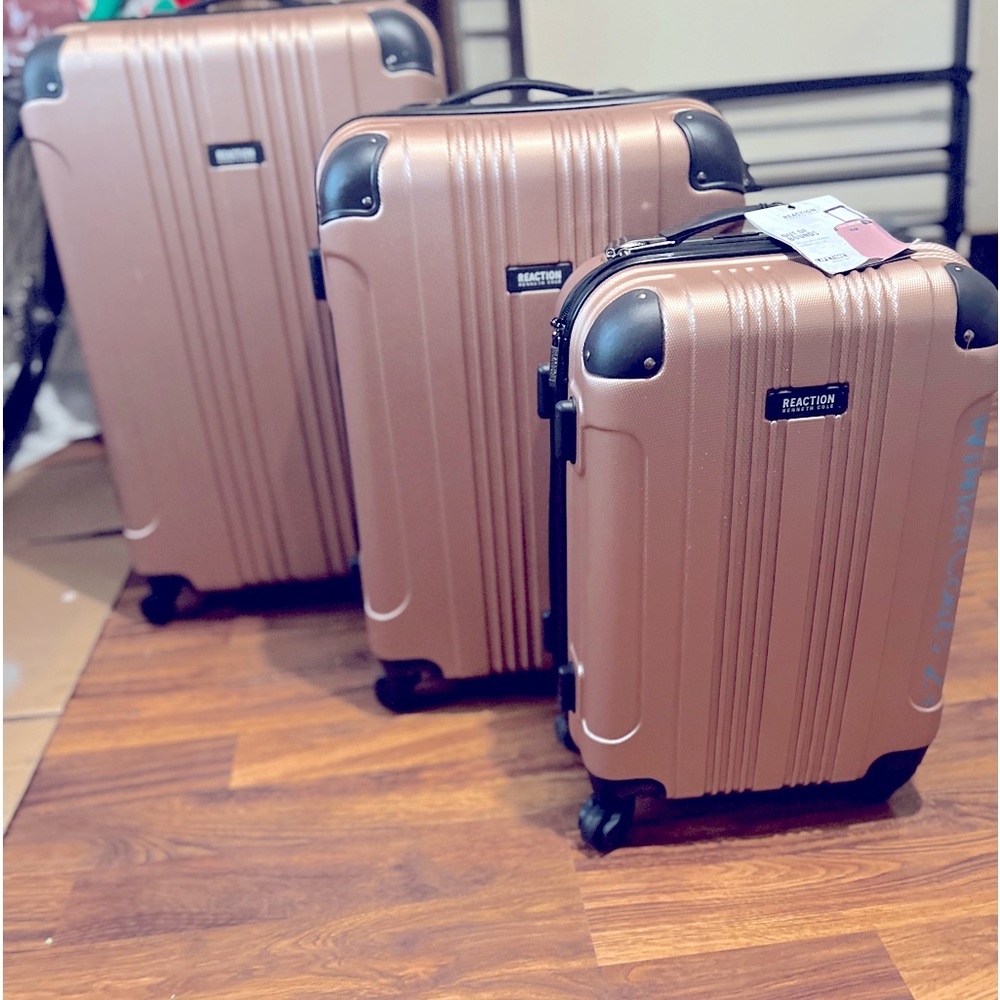 3 like new Kenneth Cole hard shell suitcases in Rose Please ask any questions.p